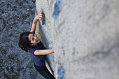 Filipino woman rock climbing, Seattle, WA