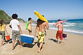 Multi-ethnic friends enjoying the beach, Caruao, Venezuela