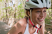 Hispanic woman wearing bike helmet