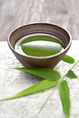Close up of Japanese green Matcha tea and bamboo sprig, Santa Fe, New Mexico, United States