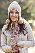 Mixed race woman in cap, scarf and gloves, Seattle, WA, USA
