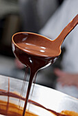 Melted chocolate dripping from ladle, Caracas, Caracas, Venezuela