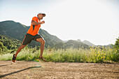 Mixed race man running on remote trail, Calabasas, California, United States