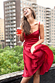Glamorous mixed race woman drinking wine outdoors, New York, New York, USA