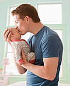 Caucasian father kissing baby girl, Lehi, Utah, USA