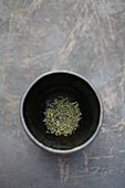 Dried sencha tea in tea cup, Santa Fe, New Mexico, USA