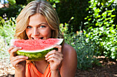 Caucasian girl eating watermelon, Sherman Oaks, CA, USA