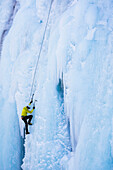 Caucasian climber scaling glacier, Ouray, CO, USA