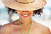 Hispanic woman smiling on beach, Long Beach, NY, USA