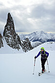 Female back-country skier ascending to Cima Cece, Lagorai, Fiemme Mountains, Trention, Italy