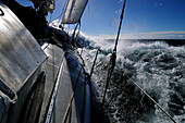Sailing boat in rough sea, Strait of Magellan, Chile