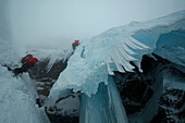 Ice climbers ascending Creag Meagaidh, Highlands, Scotland, Great Britain