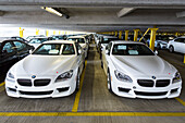 New cars in a parking garage before shipping in Bremerhaven, Germany