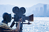 Film camera man statue on the Avenue of Stars promenade along Hong Kong Harbour waterfront, Tsim Sha Tsui, Kowloon, Hong Kong