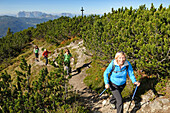 Women hiking along a ridge, Duerrnbachhorn, Reit im Winkl, Chiemgau, Bavaria, Germany