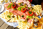 A snack plate with cheese and ham
