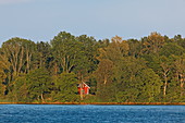 Red holiday home on the edge of lake Vaettern, Sweden