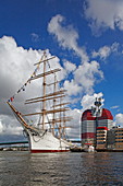 Skyscraper Lilla Bommen and a historic tall ship in the port of Gothenburg, Sweden
