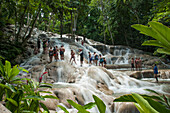 Visitors climbing Dunn's River Falls, Ocho Rios, Saint Ann, Middlesex, Jamaica