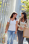 Women sisters 35 and 40 years shopping on the street. Donostia. San Sebastian. Gipuzkoa. Basque Country- Spain.