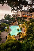 '''''Room with a View '''' from Room 101 Highlands Inn overlooking the pool and the Pacific Ocean at dusk.'''