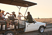 People on safari in off road vehicle, Stellenbosch, South Africa