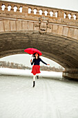 Young woman with red umbrella