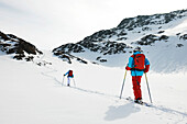 Skiers walking in snow, Kuhtai, Austria