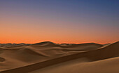 Sand dunes in desert at sunset, Adu Dhabi, United Arab Emirates