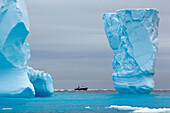 Adventure research ship Spirit of Enderby amongst ice bergs in the ice floe in the southern ocean, 180 miles north of East Antarctica, Antarctica