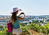 Young caucasian woman 33 years taking pictures of Prague, Czech Republic