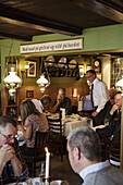 People at Restaurant Schonnemann Serving traditional Danish food, Copenhagen, Denmark.