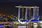 Aerial night view of Marina Bay Sand, a luxury complex that include hotel, casino, exhibition centre and a shopping mall. Singapore.