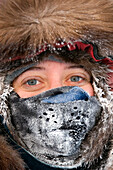 Closeup Portrait Of Young Woman In Frosted Face Mask From Snowmobile Ride In Subzero Weather Ak Winter