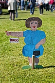 'Sign Shaped Like A Woman Pointing To Bingo; British Columbia, Canada'