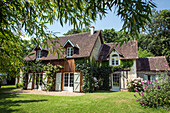 The cottage 'la grange a pain' in the park of the former priory of bouche d'aigre, romilly-sur-aigre, eure-et-loir (28), france