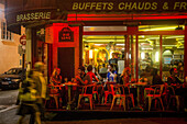 Ambiance at a parisian cafe restaurant at night, rue lepic, paris (75), france