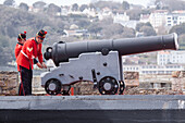 Traditional noon ceremony of firing the cannon at castle cornet, saint peter port, guernsey, channel islands