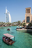 View of the hotel burj al arab from the hotel madinat jumeirah, dubai, united arab emirates, middle east