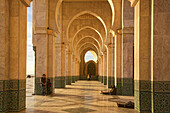 The arches of the hassan ii mosque partly erected over the sea in arab-andalusian tradition, casablanca, morocco, africa