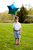 Boy Holding Blue Star Balloon