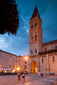 Main square and cathedral lit up at dusk, Trogir, UNESCO World Heritage Site, Dalmatian Coast, Croatia, Europe