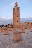 The Koutoubia minaret rises up from the heart of the old medina next to a mosque of the same name, Marrakesh. Morocco, North Africa, Africa