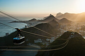 View from the Sugarloaf and the famous cable car at sunset, Rio de Janeiro, Brazil, South America