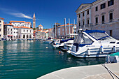 Waterfront buildings at the harbour and bell tower of Cathedral of St. George, Piran, Istria, Slovenia, Europe