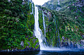 Huge waterfall in the Milford Sound, Fiordland National Park, UNESCO World Heritage Site, South Island, New Zealand, Pacific