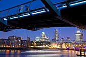 River Thames, Millennium Bridge and City of London skyline at dusk, London, England, United Kingdom, Europe