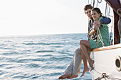 Caucasian couple relaxing on sailboat, Cape Town, Western Cape, South Africa