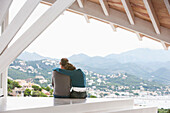 Couple admiring view from balcony, Palma de Mallorca, Balearic Islands, Spain
