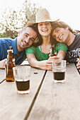 Friends drinking beer together outdoors, Palma de Mallorca, Balearic Islands, Spain
